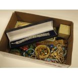 A BOX OF COSTUME JEWELLERY