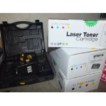 THREE BOXED LASER TONER CARTRIDGES TOGETHER WITH A CASED POWER DRILL