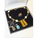 A BOX OF COSTUME JEWELLERY