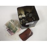 A TIN OF ASSORTED COINAGE, BANK NOTES ETC