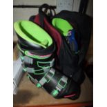 A PAIR OF SKI BOOTS AND GOGGLES IN CARRY BAG