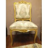 A LOUIS XV STYLE GILT PAINTED BEDROOM CHAIR WITH SILK UPHOLSTERY