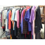 A RAIL OF ASSORTED LADIES CLOTHING (RAIL NOT INCLUDED)