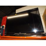 A JVC FLATSCREEN TV WITH REMOTE