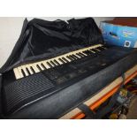 A YAMAHA KEYBOARD IN CARRY CASE