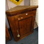 AN OAK AND MAHOGANY HANGING CORNER CUPBOARD