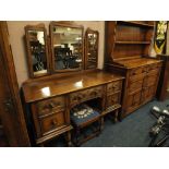 A QUALITY REPRODUCTION CARVED OAK DRESSING TABLE WITH TRIPLE MIRROR AND A STOOL W 122 CM
