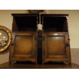 A QUALITY PAIR OF REPRODUCTION CARVED OAK BEDSIDE CABINETS (2)