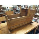 AN ANTIQUE CHILDS WOODEN ROCKING CRADLE L 91 M