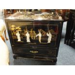 A PAINTED ORIENTAL LOW CABINET WITH MOTHER OF PEARL FIGURATIVE DETAIL