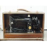 A CASED VINTAGE SINGER SEWING MACHINE