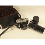 A CASED VINTAGE ZENIT E CAMERA WITH LENS