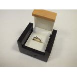 A BOXED 9CT GOLD 0.33 CT DIAMOND RING