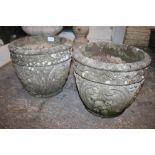 A PAIR OF STONE GRAPEVINE DETAIL PLANTERS