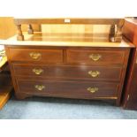 A LOW EDWARDIAN MAHOGANY FOUR DRAWER CHEST