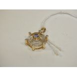 A HALLMARKED 9K GOLD WHITE QUARTZ TANZANITE AND DIAMOND PENDANT, the white quartz is approx 5.8