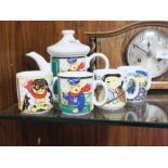 A WADE LOCOMOTIVE JOE TEAPOT AND FOUR MUGS (5)