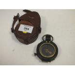 AN ANTIQUE LEATHER CASED VERNERS PATTERN POCKET COMPASS