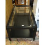 A MODERN BLACK GLASS TOPPED COFFEE TABLE L 120 CM