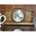 AN OAK BARLEY TWIST MANTEL CLOCK