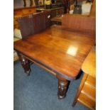 A VICTORIAN MAHOGANY WIND-OUT DINING TABLE RAISED ON FLUTED SUPPORTS WITH TWO SPARE LEAVES H-73 W-