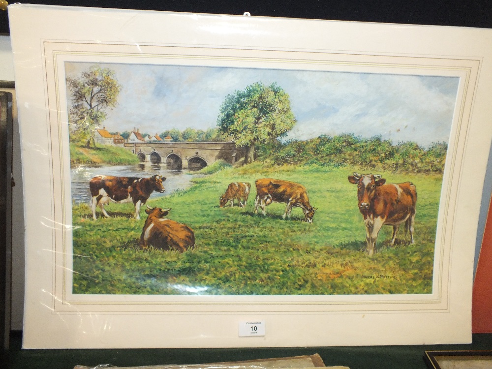 A MOUNTED WATERCOLOUR OF CATTLE GRAZING BY A BRIDGE OVER THE RIVER SIGNED HARRY W POTTER