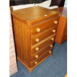 A HONEY PINE SLIM FIVE DRAWER CHEST W-61 CM