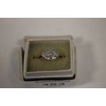 AN 18 CT GOLD NINE STONE DIAMOND DRESS RING