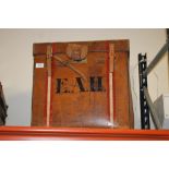 A BOX SHAPED LEATHER CASE MONOGRAMMED E.A.H.