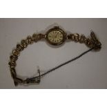 A VINTAGE LADIES 9CT GOLD FELEA PRESCOTT WRISTWATCH WITH 9CT GOLD STRAP