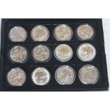 TWELVE SILVER 1 OZ BRITANNIA COINS, in a Royal Mint card box