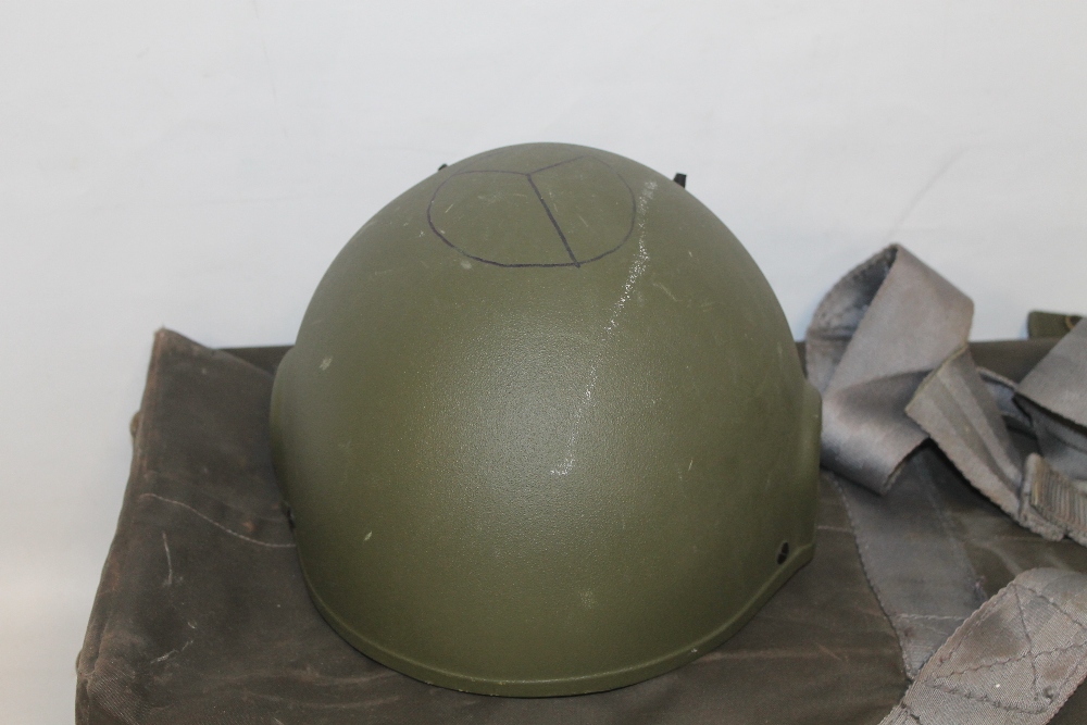 THREE BRITISH ARMY KEVLAR COMBAT HELMETS, two with fabric camouflage covers, together with a G-Q Pa - Image 2 of 4