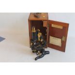 AN EARLY 20TH CENTURY "W. WATSON AND SONS LTD" SERVICE MICROSCOPE, in box together with extra lens,