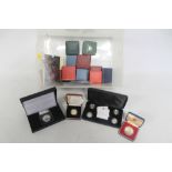 A QUANTITY OF CASED SILVER PROOF COINS to include a 2010/2011 four coin £1 set, 1990 two coin set,
