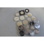 A QUANTITY OF SILVER PROOF COINS IN CAPSULES , to include £1 , £2, and £5 coins etc.