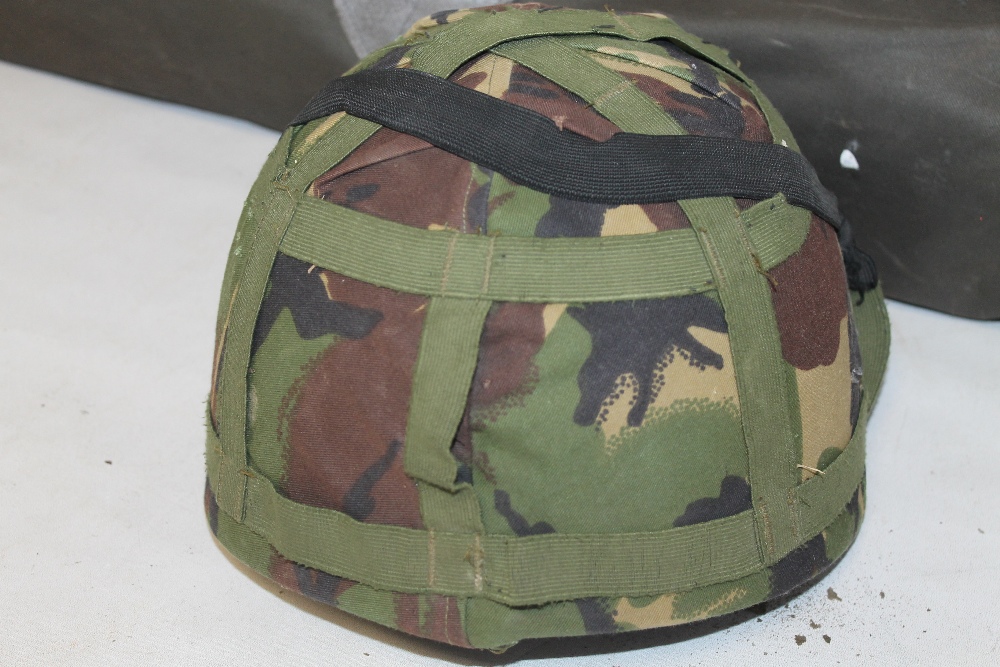 THREE BRITISH ARMY KEVLAR COMBAT HELMETS, two with fabric camouflage covers, together with a G-Q Pa - Image 3 of 4