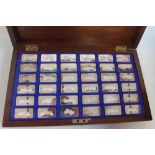 A CASED SET OF 36 SILVER INGOTS, "The Lord Montagu Collection of Great Cars" with certificates of