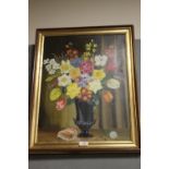 A FRAMED STILL LIFE OIL ON BOARD DEPICTING FLOWERS IN A VASE