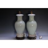 A PAIR OF CELADON LAMPS, with floral decoration, a/f, H 46.5 cm including wooden stand