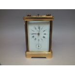 A BRASS CASED REPEATER CARRIAGE CLOCK, enamel dial bearing Roman numerals, retailed by 'Eurotime',