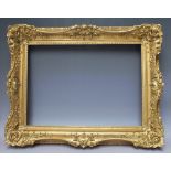 A 19TH CENTURY GILT SWEPT FRAME, rebate 35 x 50 cm,width of frame, 8 cm,