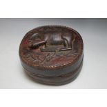 A CARVED WOODEN BOX DECORATED TO THE LID WITH A TIBETAN STYLE DEER, W 20 cm