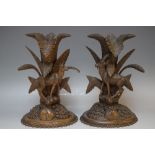 A PAIR OF BLACK FOREST TYPE VASES, with goats amongst the foliage, H 24.5 cm