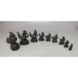 A GRADUATED SET OF EIGHT ORIENTAL CAST BRONZE WEIGHTS IN THE FORM OF COCKERALS, largest H 6.2 cm,