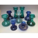 FOUR VICTORIAN BRISTOL BLUE GLASS HYACINTH VASES, tallest H 15 cm, together with a pair of Bristol