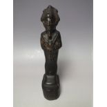 AN EGYPTIAN CARVED STONE OSIRIS FIGURE, black basalt, H 20 cm