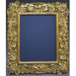 A LATE 17TH / EARLY 18TH CENTURY HIGHLY DECORATIVE GOLD FRAME, with sunflowers and interwoven