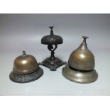 THREE VINTAGE RECEPTION / DESK BELLS, comprising two of simple classical form and an ornate cast