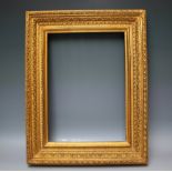 A 19TH CENTURY HEAVILY DECORATED GOLD FRAME, with running pattern and acanthus leaves, frame W 9 cm,