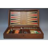 AN EDWARDIAN TYPE MAHOGANY GAMES BOX AND CONTENTS, W 42 cm